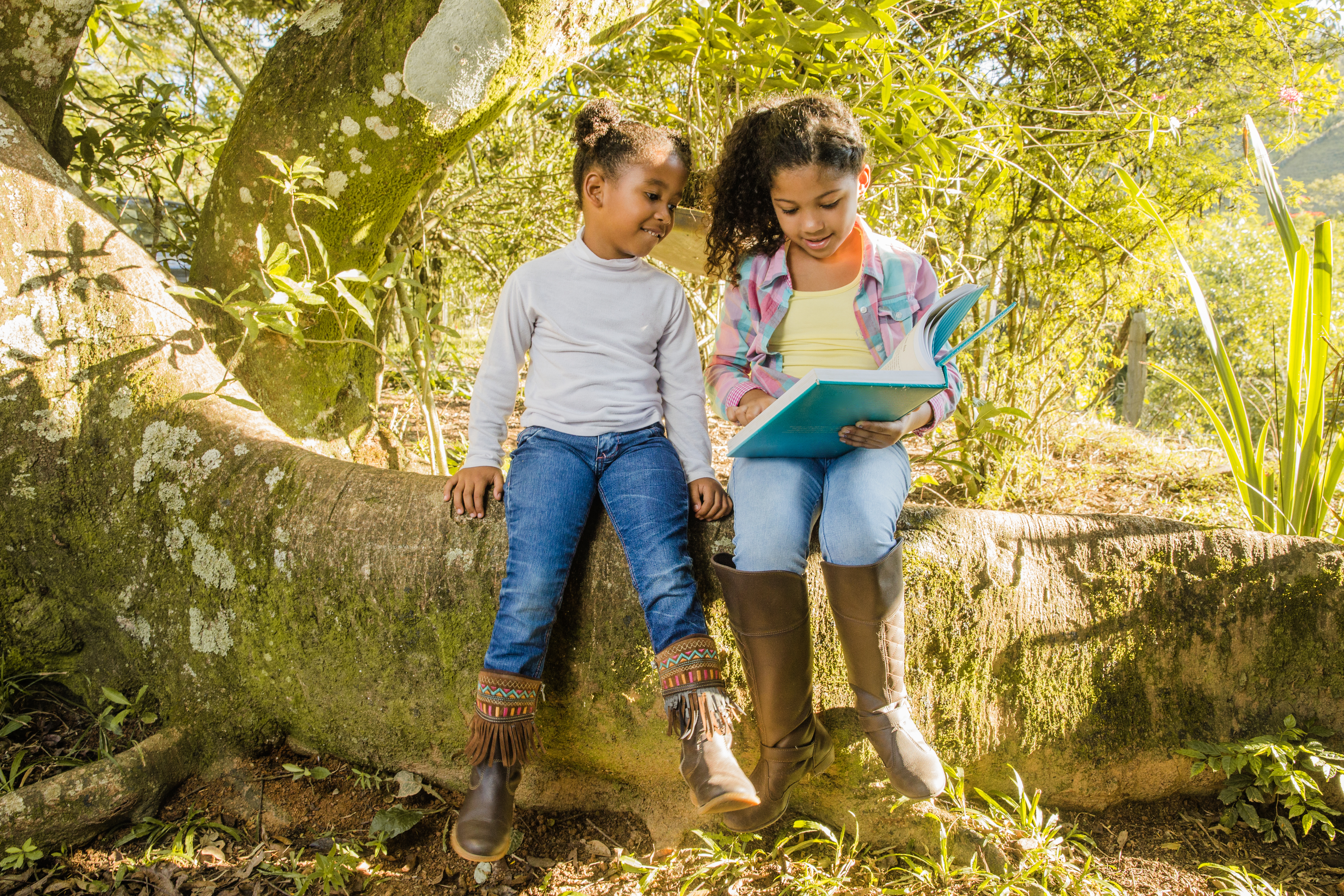 two-young-girls-tree-reading-together.jpg?1738958173862